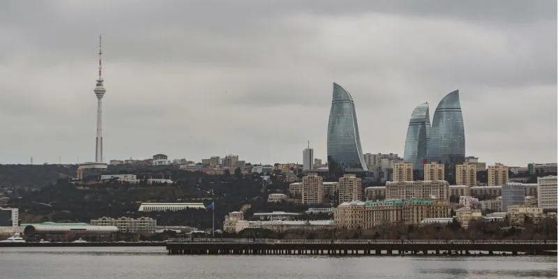 A city skyline featuring modern skyscrapers and flame tower of Azerbaijan