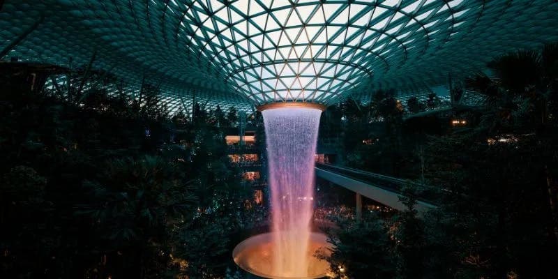 Indoor waterfall under geometric dome at Singapore Changi airport