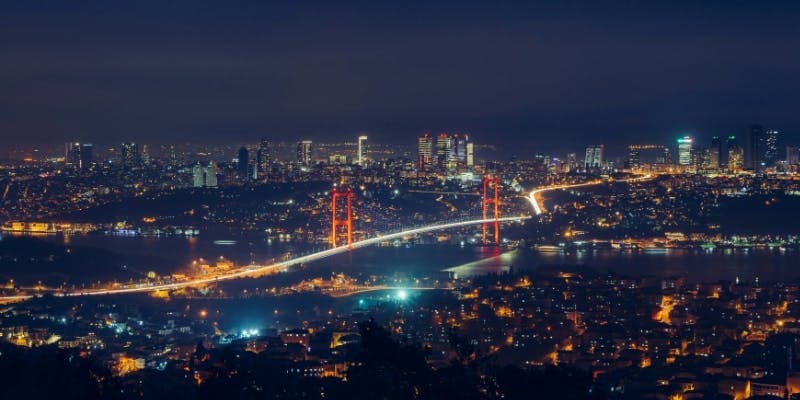 Night time view of the Bosphorus Bridge connecting Europe and Asia in Istanbul, a prime destination for holders of a Turkey tourist visa.